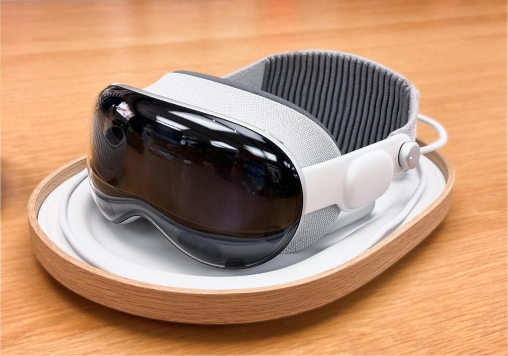 pexels-photo-29073142-29073142 A sleek and modern virtual reality headset on a wooden surface.
